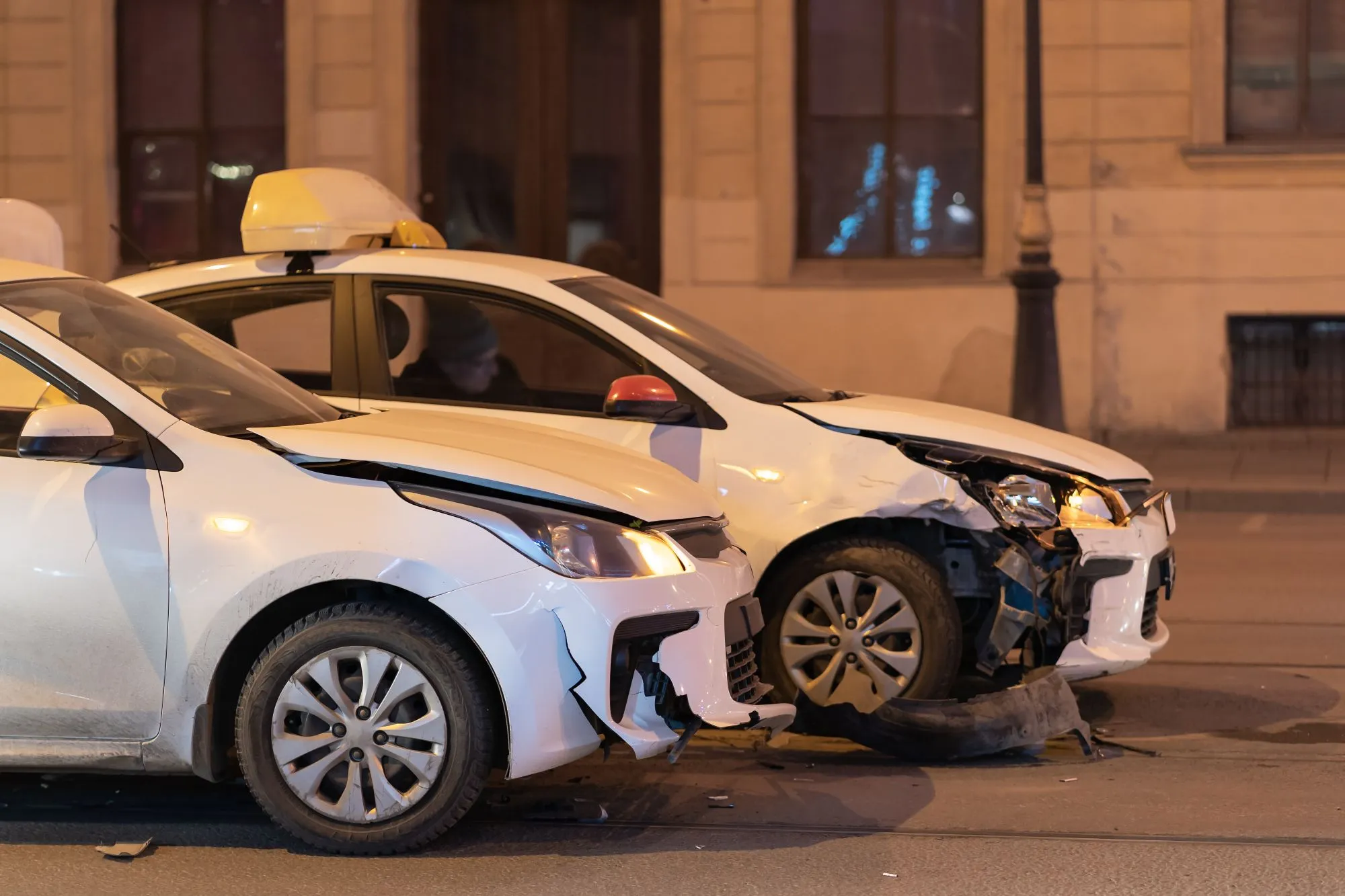 damaged white cars road after accident with damaged bumpers careles driving
