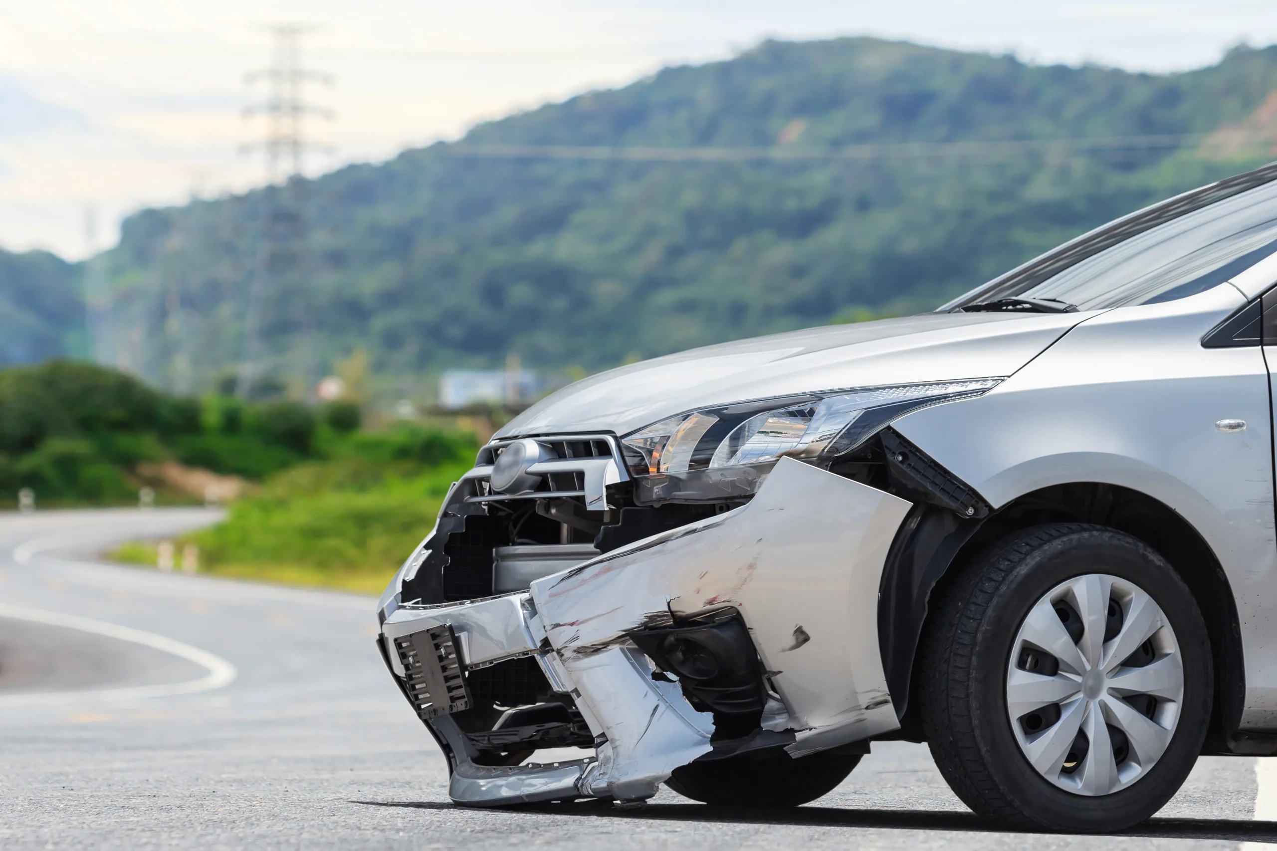 front silver car get damaged by crash accident road (1)