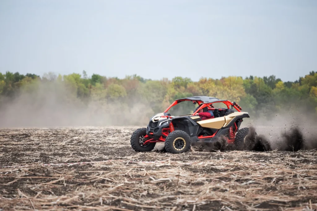 quad bike with driver plowed field